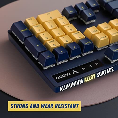 Rapoo V500 Pro Mechanical Gaming Keyboard Yellow & Blue Edition with Blue Switches, Spill-Resistant Design & Aluminium Alloy Surface Cover.